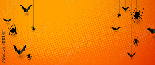 Half tone Halloween background with spiders and bats.