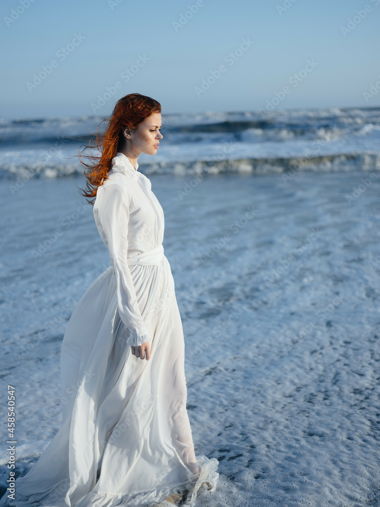 Woman in white dress beach travel vacation landscape Woman in white dress beach travel vacation landscape