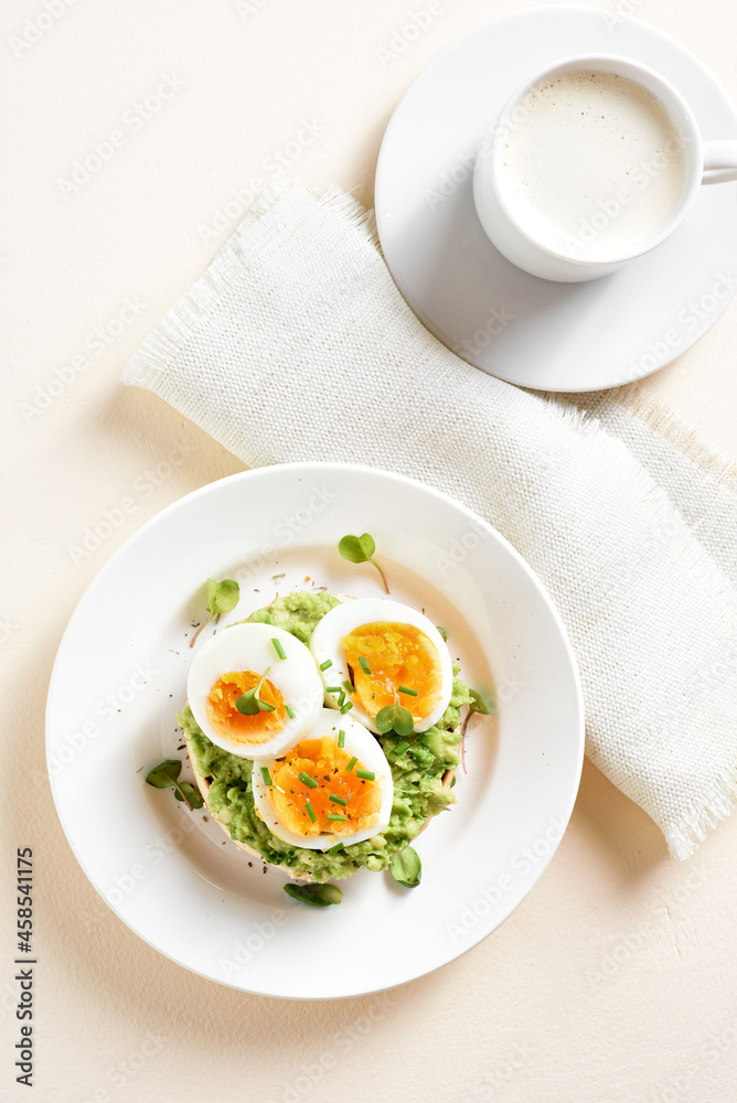 Avocado egg sandwich and cup of coffee Avocado egg sandwich and cup of coffee