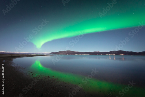 Reflections of Northerns Lights in Fjord in Alta, FInnmark, Norway 