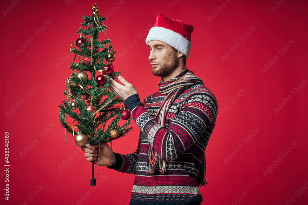 man with decorated christmas tree holiday christmas fun red background man with decorated christmas tree holiday christmas fun red background