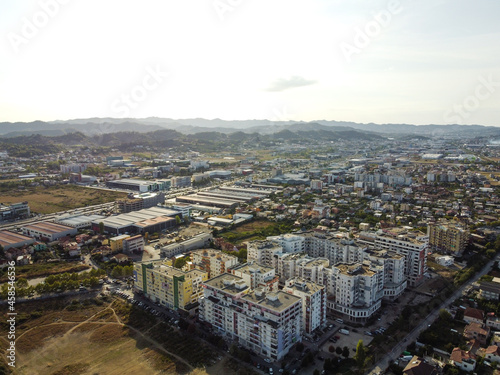 Fototapeta Naklejka Na Ścianę i Meble -  Aerial drone view Tirana, Albania. Buildings, streets and residential houses. A view from above on the roof of the houses in city of Tirana.	