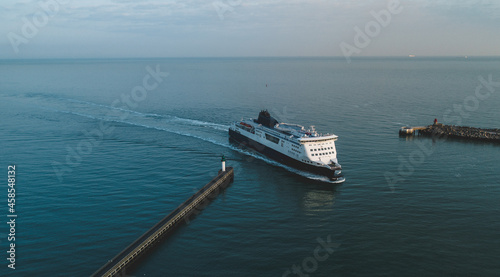 A Passenger Ferry Crossing the Sea and Arriving into Port