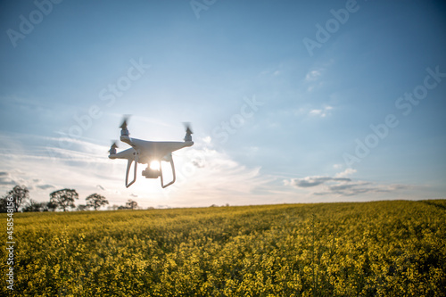 A Drone Flying Over Farmland Photographing and Surveying photo