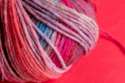 ball of colourful red self striping yarn 