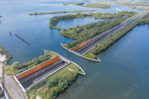 Lake Viaduct in the Netherlands with a Motorway Passing Under photo