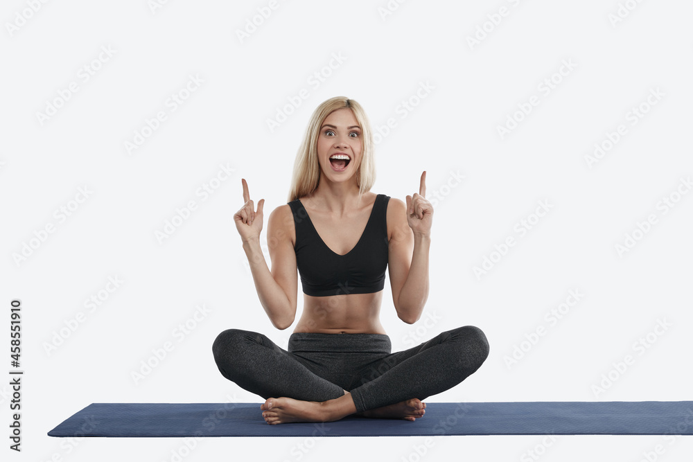 Sportswoman practicing yoga and having new idea