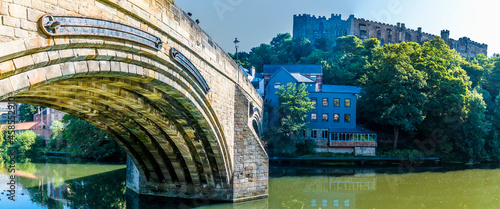 A view across the River Wear beside the Elvet Bridge in Durham, UK in summertime photo