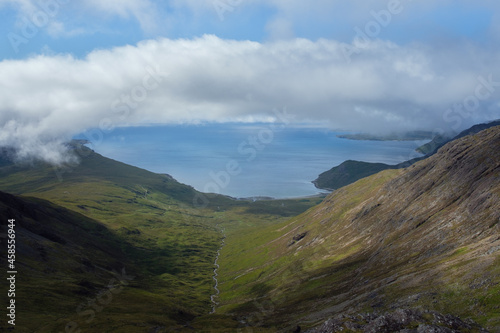Clouds over a sea bay surrounded by mountains. Camasunary, Isle of Skye, Scotland 