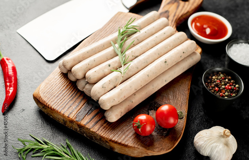 raw bavarian sausages on a stone background