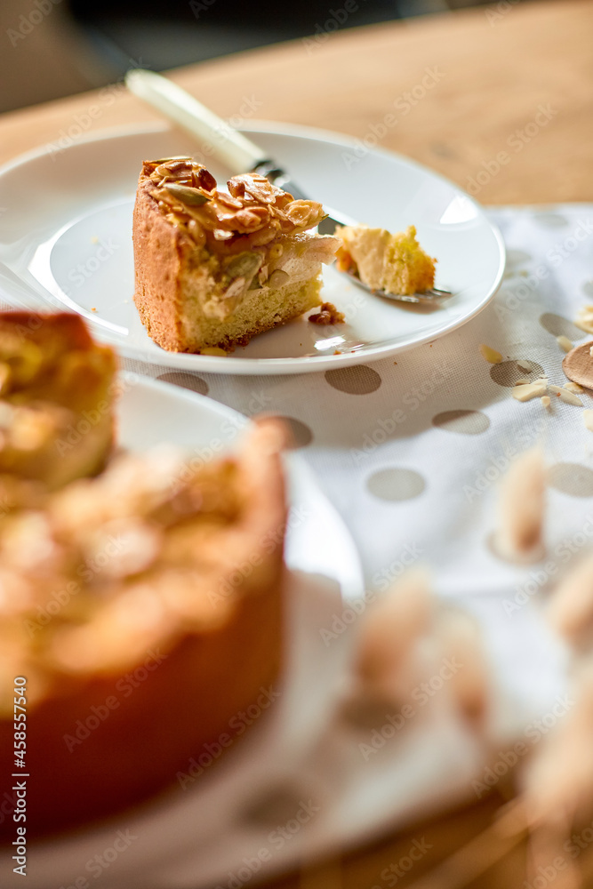 Piece of apple or pear pie, tart with caramel nuts on wooden table, copy space, top view. Piece of apple or pear pie, tart with caramel nuts on wooden table, copy space, top view.