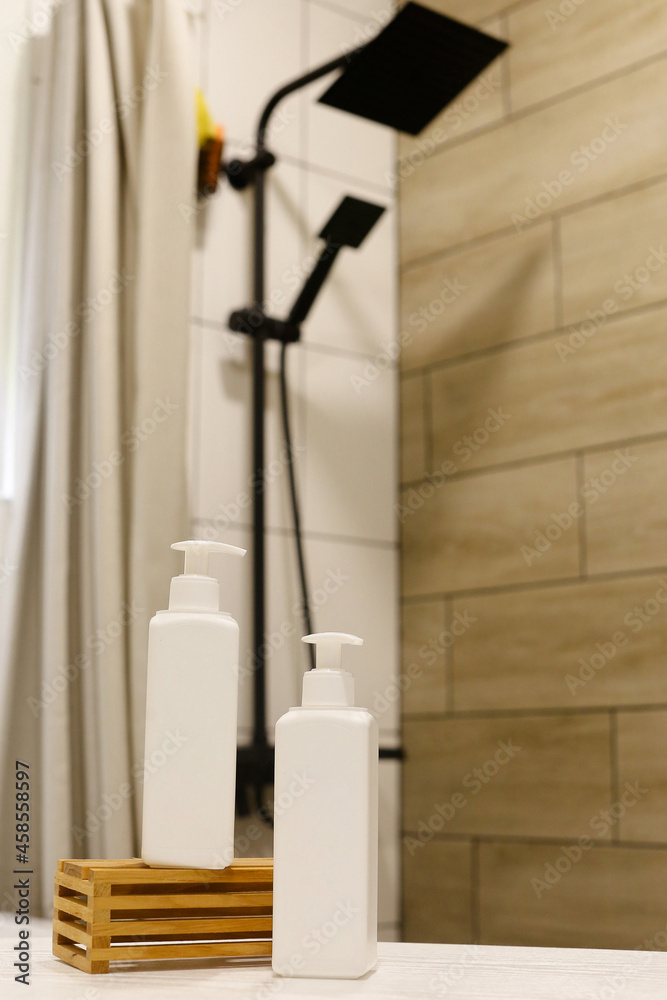 White Plastic dispenser bottles with body cream White Plastic dispenser bottles with body cream