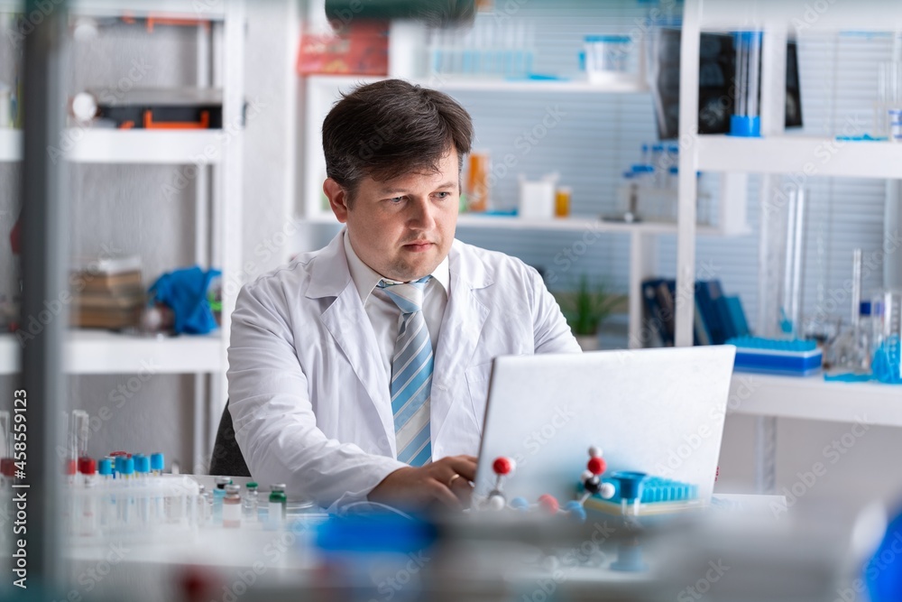 Medical Research in Laboratory: Portrait of a Male Scientist Using Computer to Analyse Data. Advanced Scientific Lab for Medicine, Biotechnology, Microbiology Development