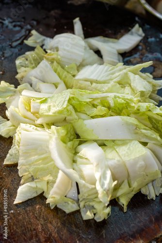 Chopped chinese cabbage close-up on cutting board