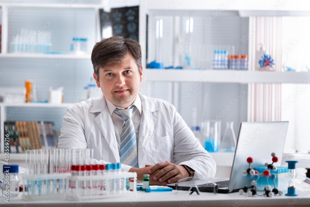 Medical Research in Laboratory: Portrait of a Male Scientist Using Computer to Analyse Data. Advanced Scientific Lab for Medicine, Biotechnology, Microbiology Development Medical Research in Laboratory: Portrait of a Male Scientist Using Computer to Analyse Data. Advanced Scientific Lab for Medicine, Biotechnology, Microbiology Development
