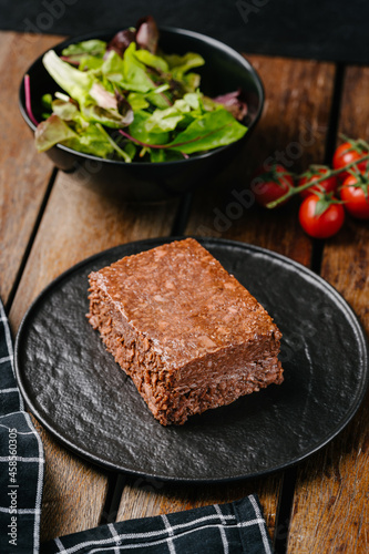 Raw vegetable vegan minced meat pate on wooden table. Copy space