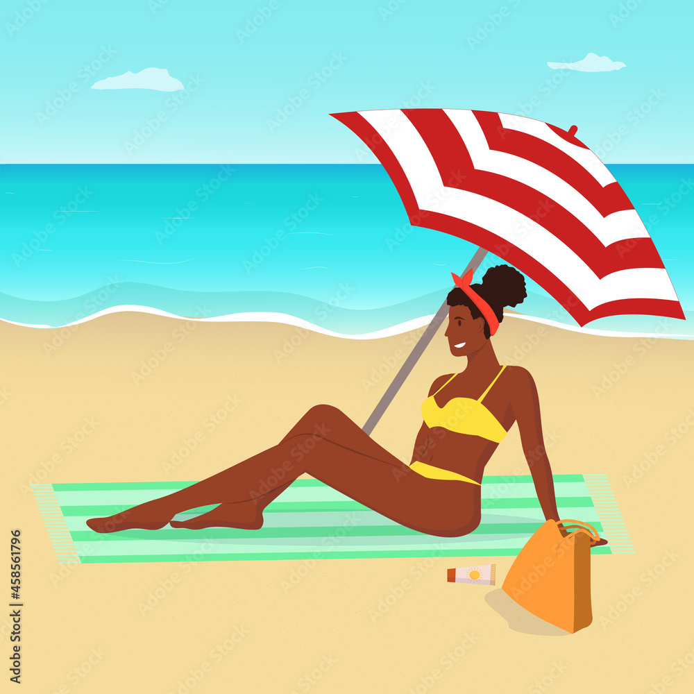 A black woman in a swimsuit sits under an umbrella on the beach. Woman sunbathes on the beach.Beach background