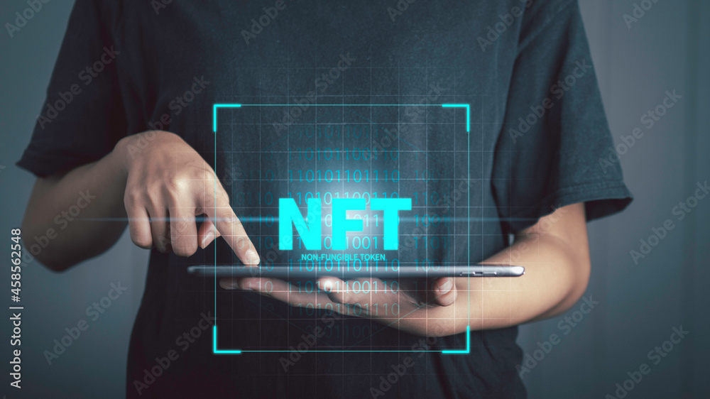 NFT non fungible tokens concept. Businessman with tablet holding digital  unique art NFT hologram on digital Stock-Illustration | Adobe Stock