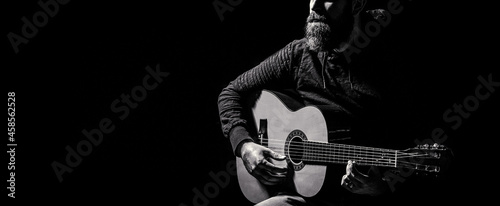 Acoustic guitars playing. Music concept. Guitars acoustic. Live music. Man's hands playing acoustic guitar, close up. Music festival. Male musician playing guitar, music instrument photo