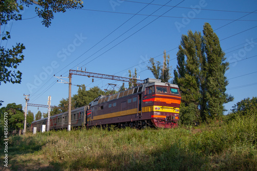 A passenger train moving on the tracks near the station Rostov-Main