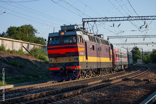 A passenger train moving on the tracks near the station Rostov-Main