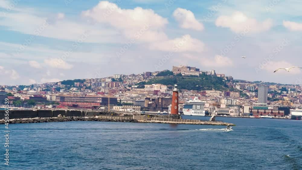 Naples coastline and cityscape from a moving boat in the sea in summer season