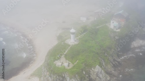 Aerial view of Nazimov lighthouse on high rocks photo