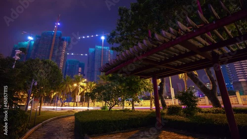 night time illuminated sanya traffic street riverside park panorama timelapse 4k hainan island china photo