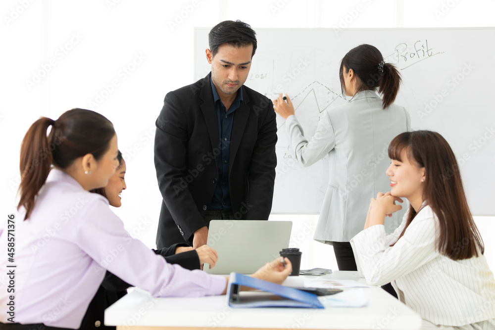 businesspeople team meeting or seminar, and presentation about work project from laptop computer in meeting room businesspeople team meeting or seminar, and presentation about work project from laptop computer in meeting room