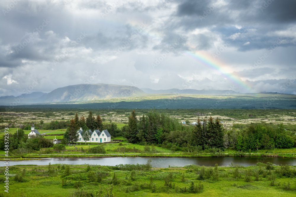 Panorama of Thingvellir National Park with a rainbow in summer, Iceland