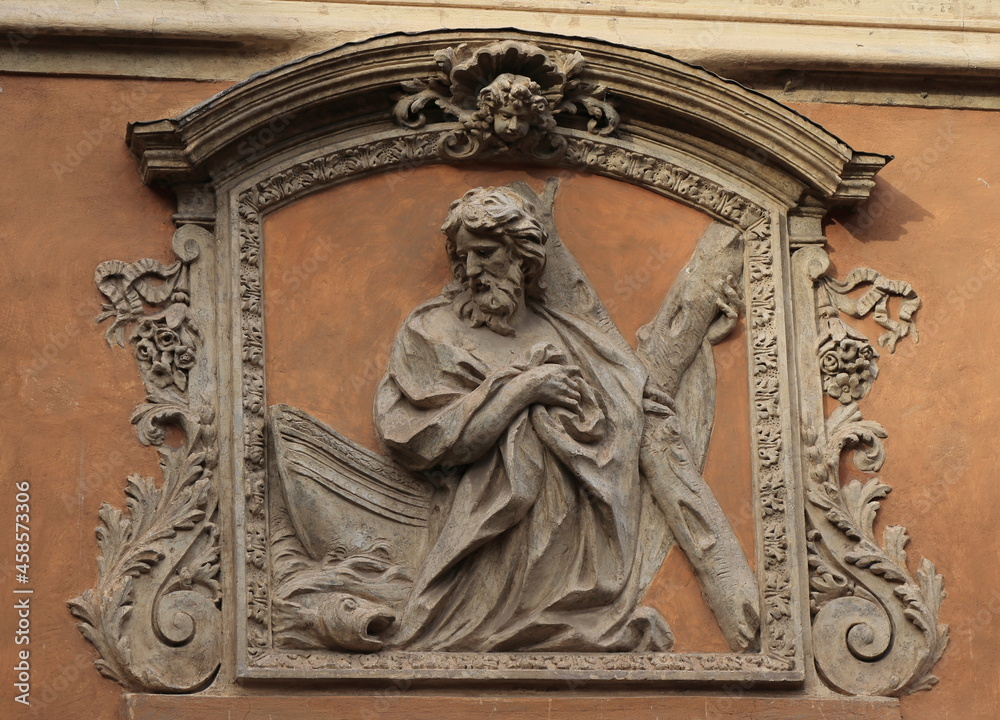High Relief of Saint Andrew with a Fish and a Boat on the Sant'Andrea dei Pescivendoli Former Church Facade in Rome, Italy