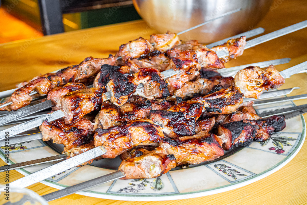 Russian shashlik with skewers on plate and wooden table Norway. Russian shashlik with skewers on plate and wooden table Norway.
