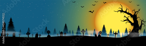 halloween cemetery in front of woodlands with full moon