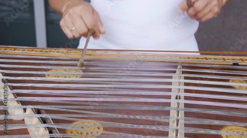 Playing stringed instrument. Hammered dulcimer close up. Leisure and hobby concept. Meditation music. Musician playing hammered dulcimer close-up. Stringed percussion musical instrument sounds good photo