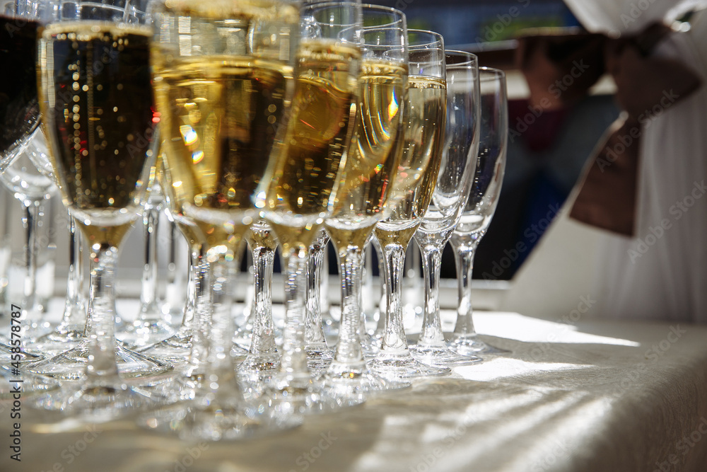 in several rows glasses with drinks of white and red wine in several rows glasses with drinks of white and red wine