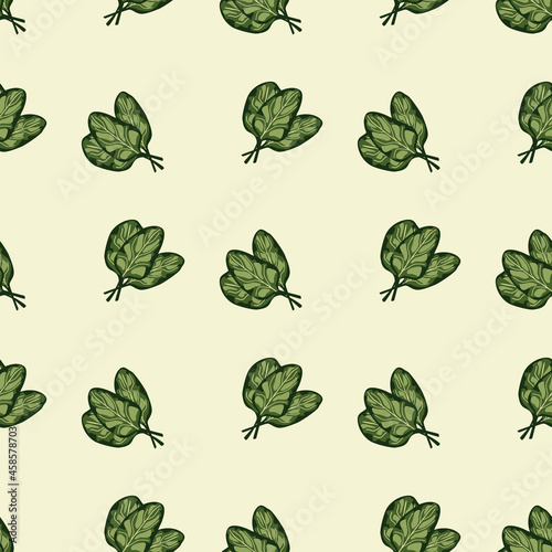 Seamless pattern bunch spinach salad on beige background. Simple ornament with lettuce.