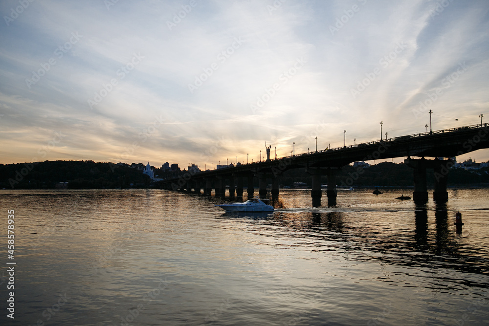 evening landscape of the city against the background of a large river evening landscape of the city against the background of a large river
