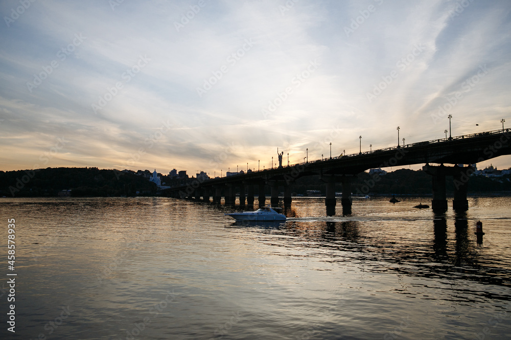 evening landscape of the city against the background of a large river