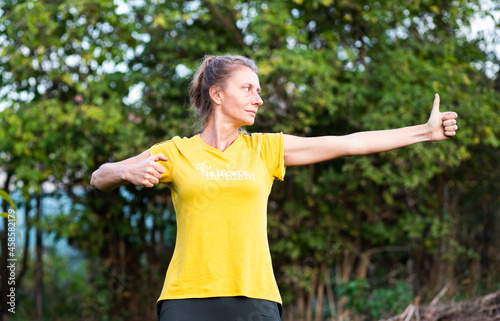 woman doing qi gong outdoors