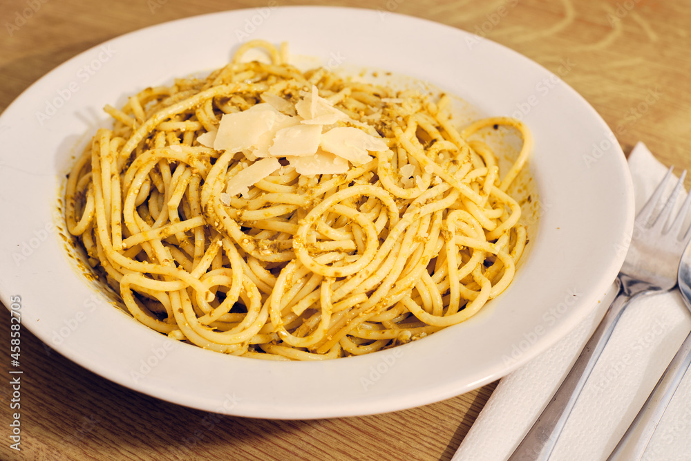Spaghetti with basil pesto on plate