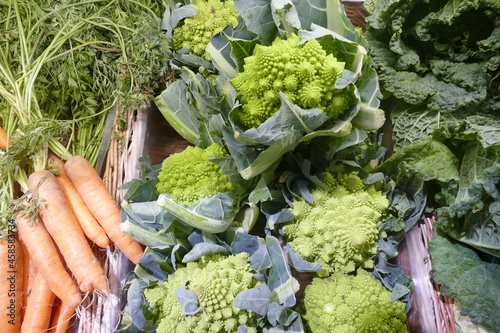 Food basket with autumn vegetables. Romanesco, cauliflower, carrots. 