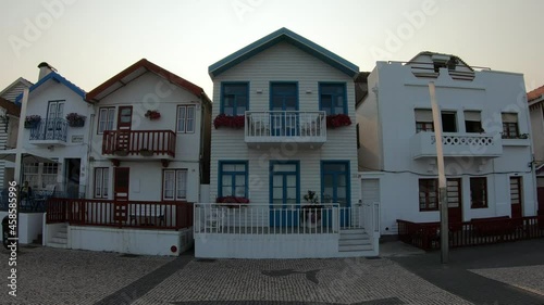 Costa Nova, Portugal, August 21, 2021: SLOW MOTION SHOT - The Colorful Houses in Costa Nova, Aveiro. The striped colorful houses are known as palheiros which in Portuguese means haystack.  