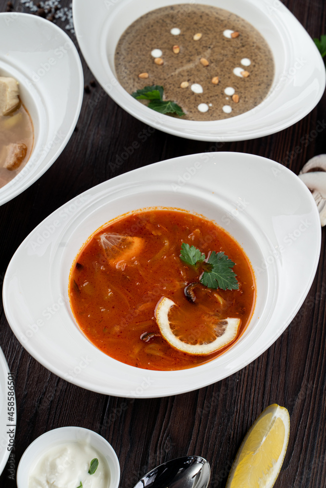 Assortment of soups in a restaurant menu: mushroom cream soup, peasants' soup, borsch and chicken soup Assortment of soups in a restaurant menu: mushroom cream soup, peasants' soup, borsch and chicken soup