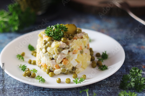 Olivier salad, traditional Russian dish, served on the plate