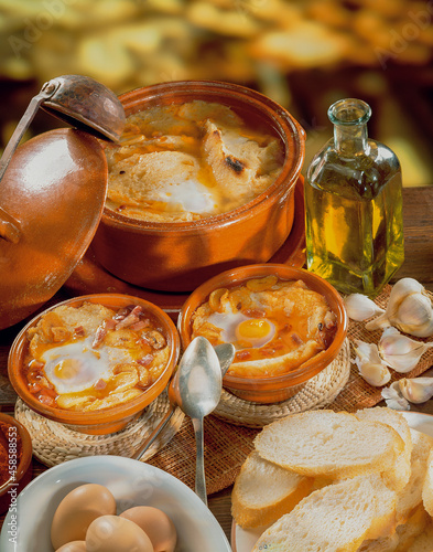 Sopa castellana o sopa de ajo sobre mesa de madera. Castilian soup or garlic soup on wooden table photo