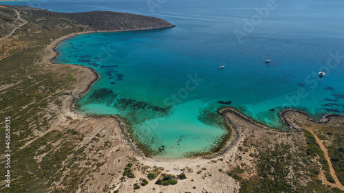Aerial drone photo of paradise turquoise secluded sandy beach of Lefki or White in island of Elafonisos next to popular beach of Simos, South Peloponnese, Lakonia, Greece