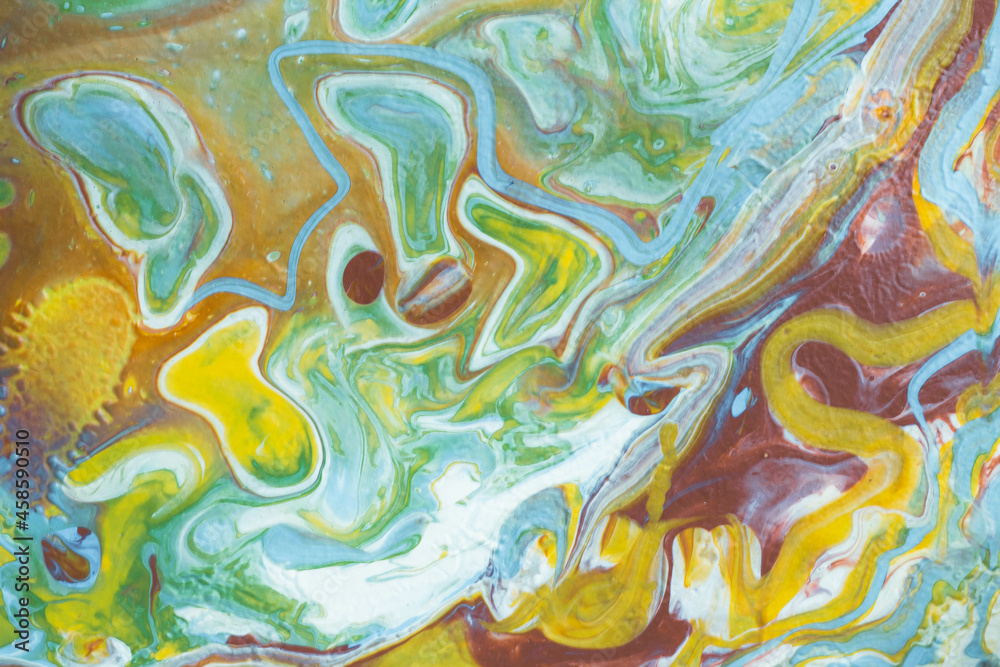Abstract background from spilled paints. Multi-colored paints on canvas. Abstract background from spilled paints. Multi-colored paints on canvas.