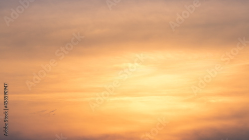 Fototapeta Naklejka Na Ścianę i Meble -  Wonderful view of cumulus clouds sky with orange sun light at sunset of summer