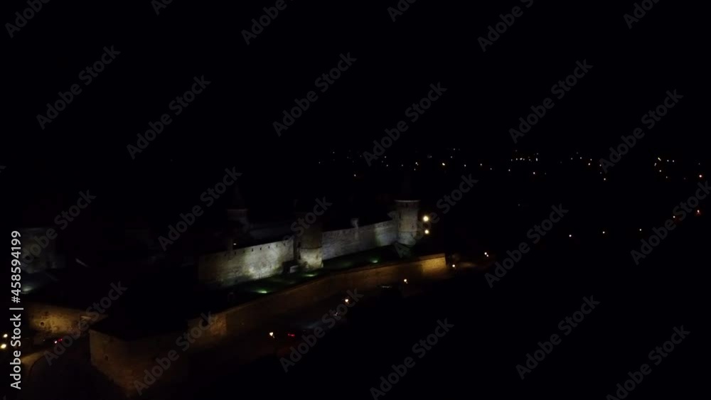 View of Kamianets-Podilskyi Castle in the night. Drone Video. Ukraine. Europe View of Kamianets-Podilskyi Castle in the night. Drone Video. Ukraine. Europe