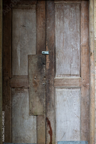 traditional vintage house door made of wood with brown color for abstract background